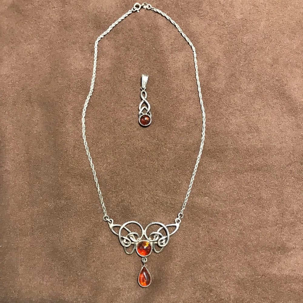 Silver and amber Celtic knot work pendant and necklace.